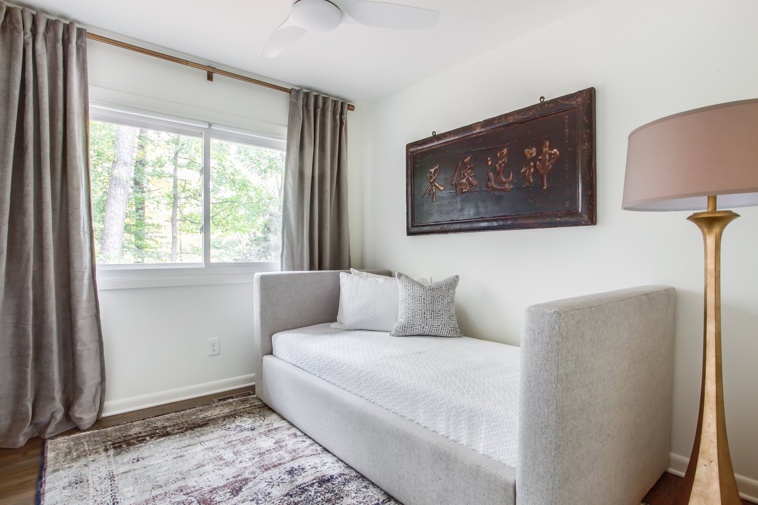 Bedroom with a Single Bed, Window, and Floor Lamp.