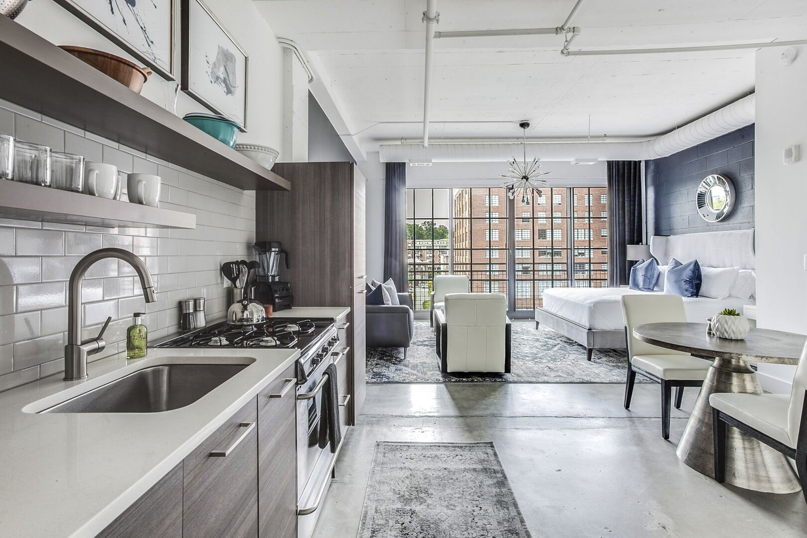 Picture was taken from inside the kitchen with a view of the living area and sleeping area.