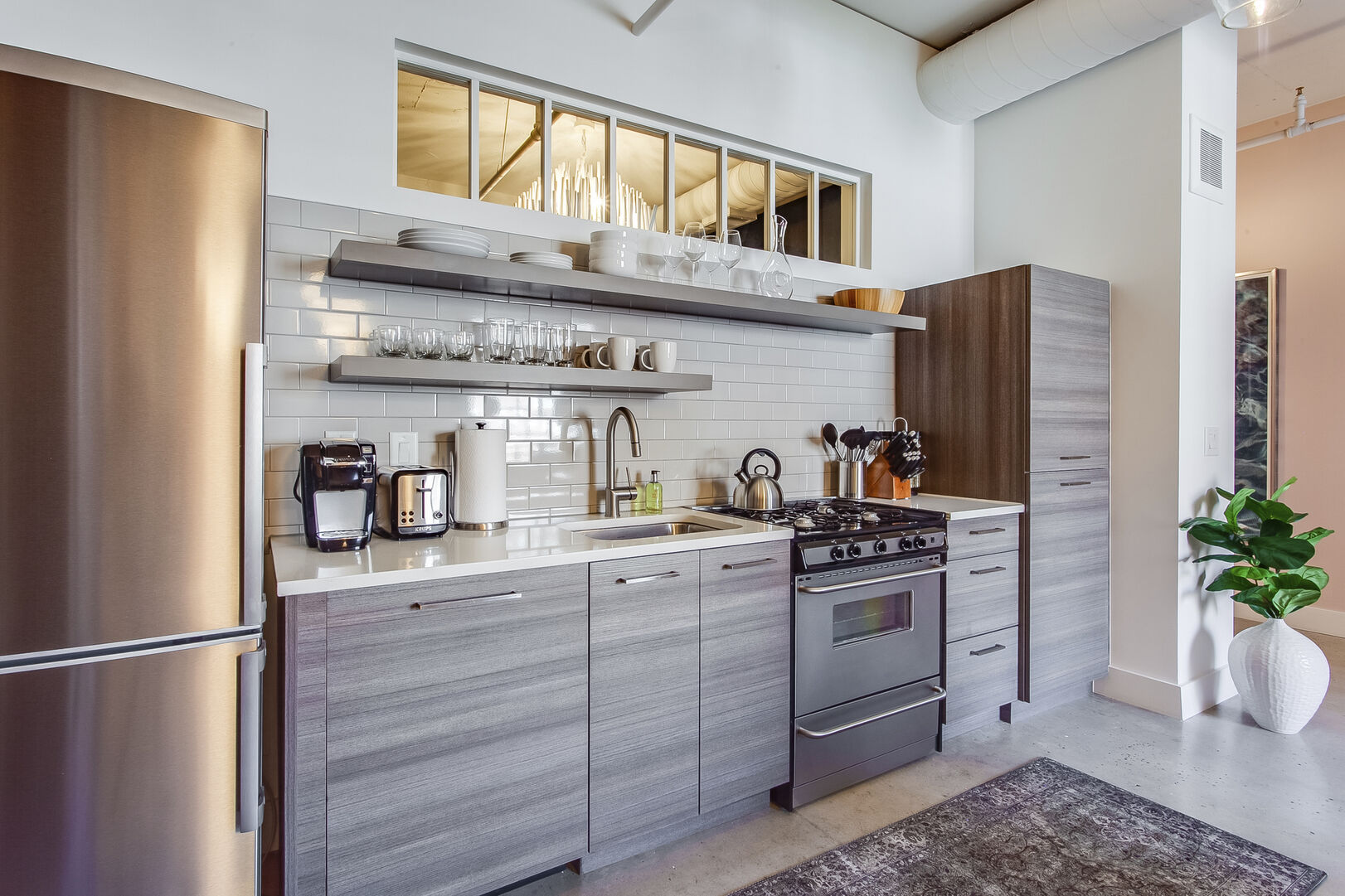 Modern Kitchen Includes Stainless Steel Appliances.