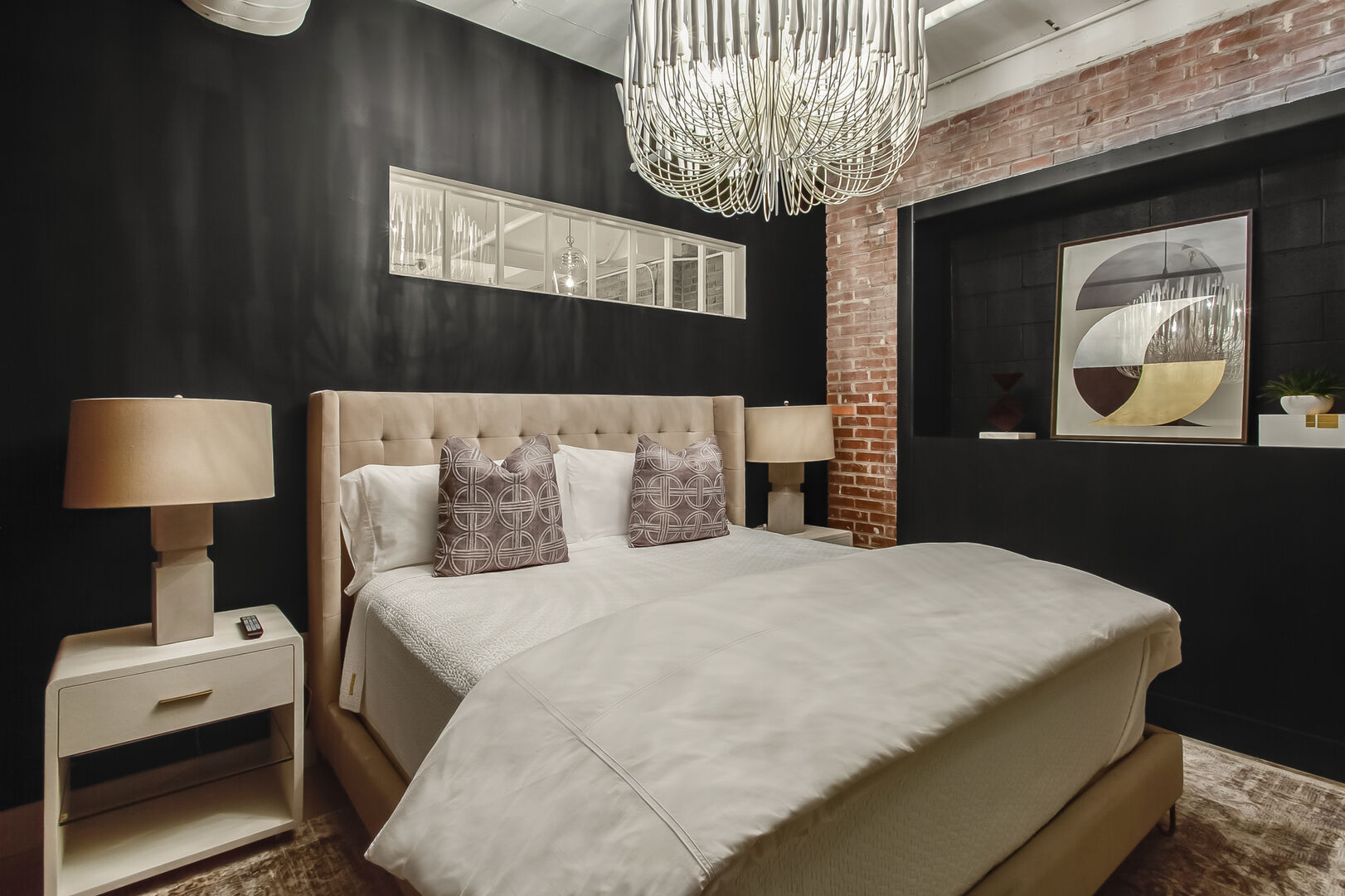 Bedroom Includes Two Side Tables and Beautiful Chandelier.