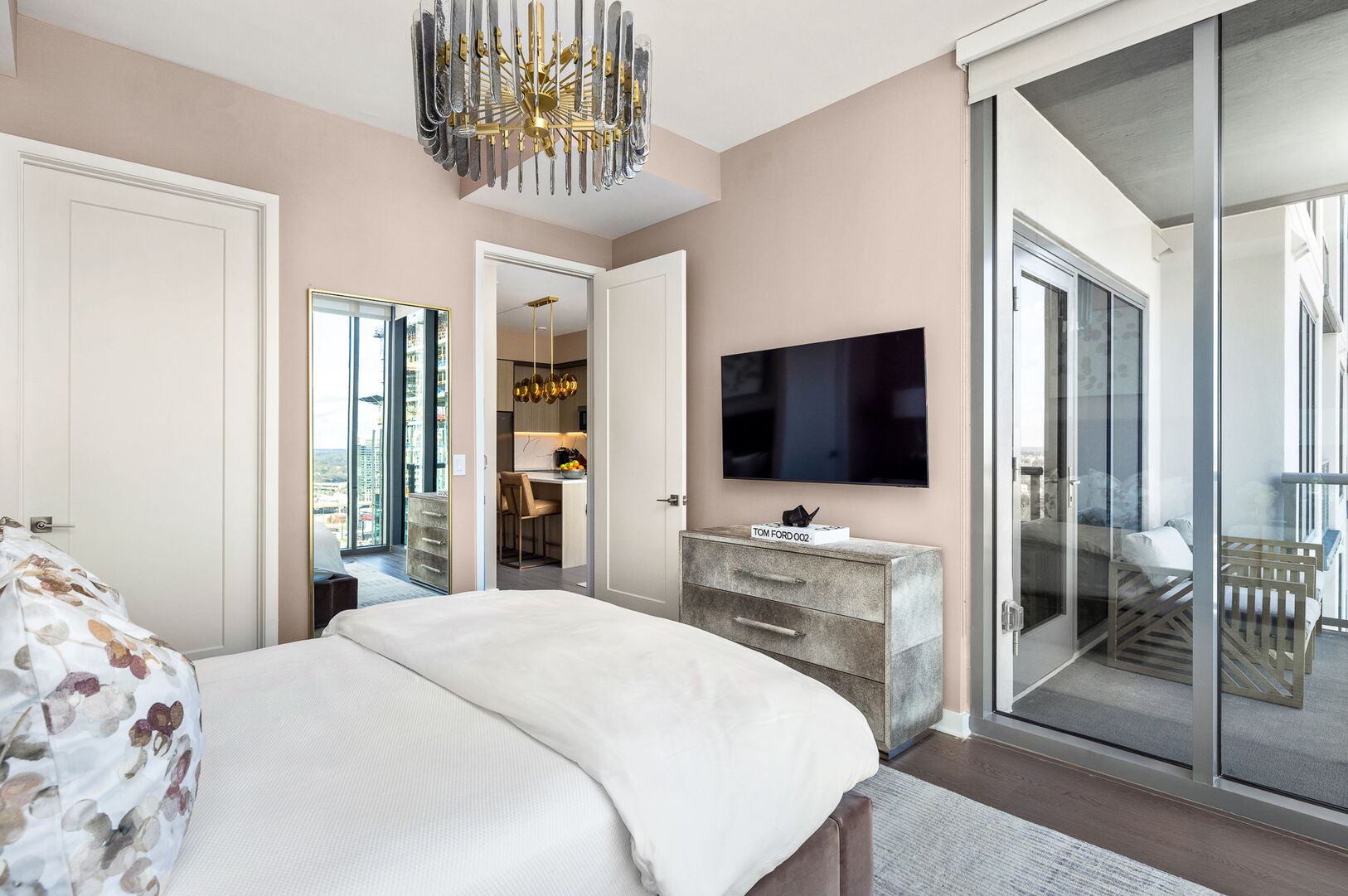 Primary suite with a king bed and a 55 4K UHD TV