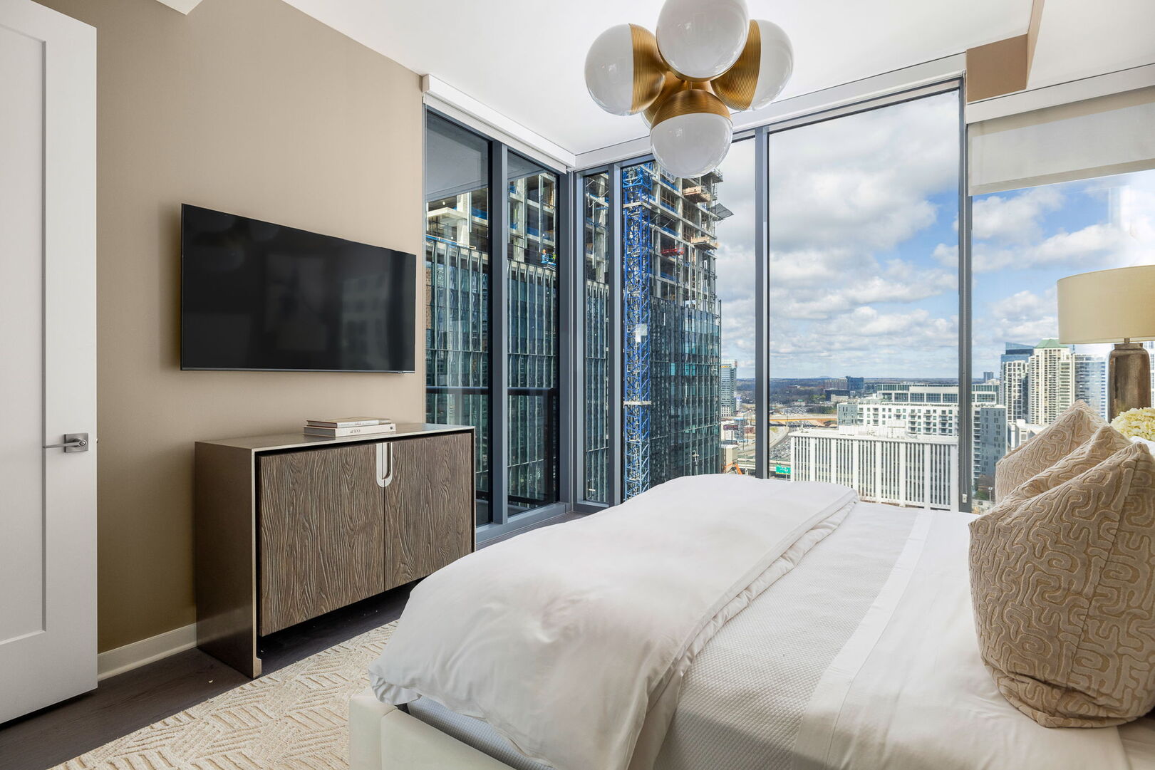 Primary suite with a king bed and a 55 4K UHD TV