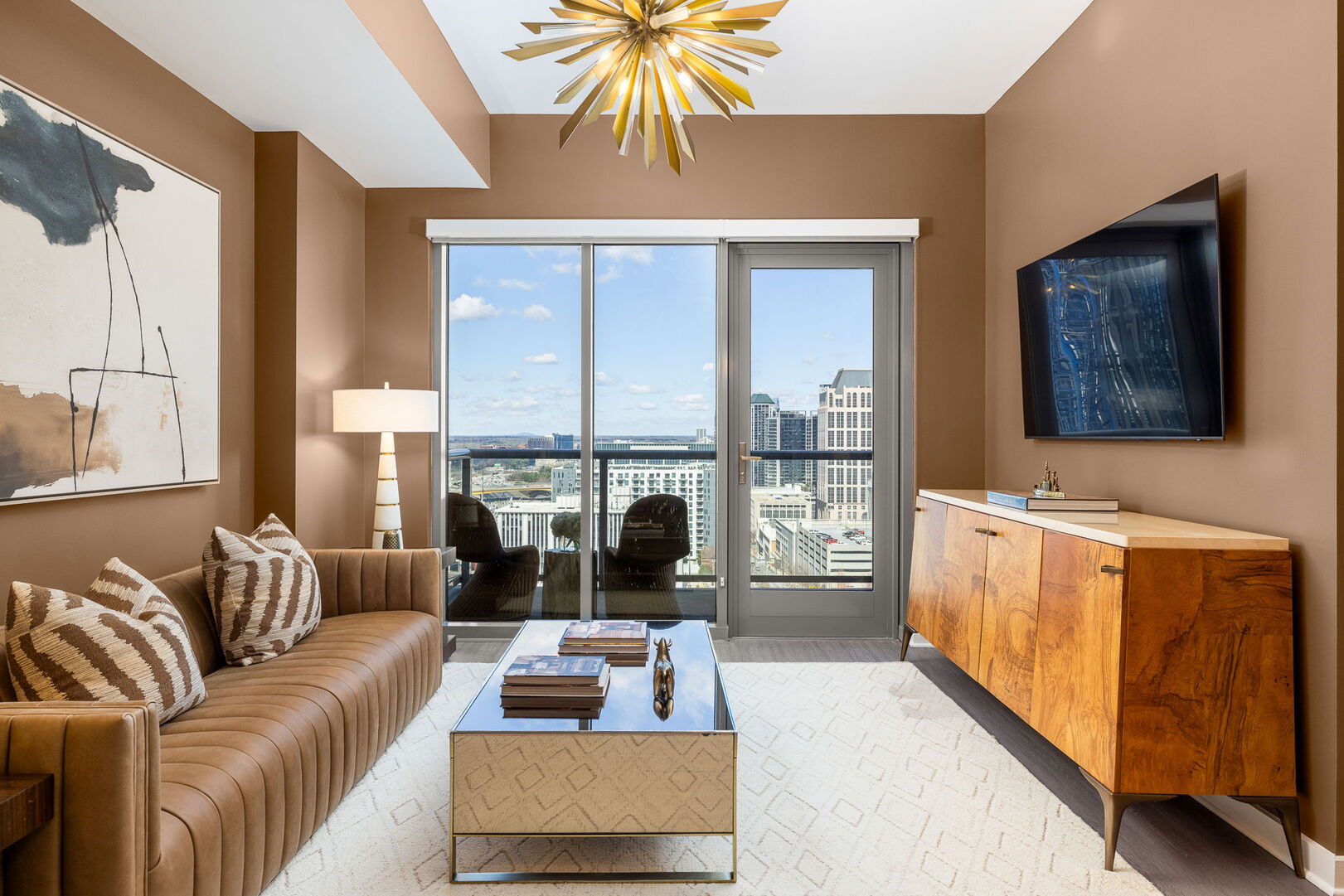 Living room featuring a 65 4K UHD TV