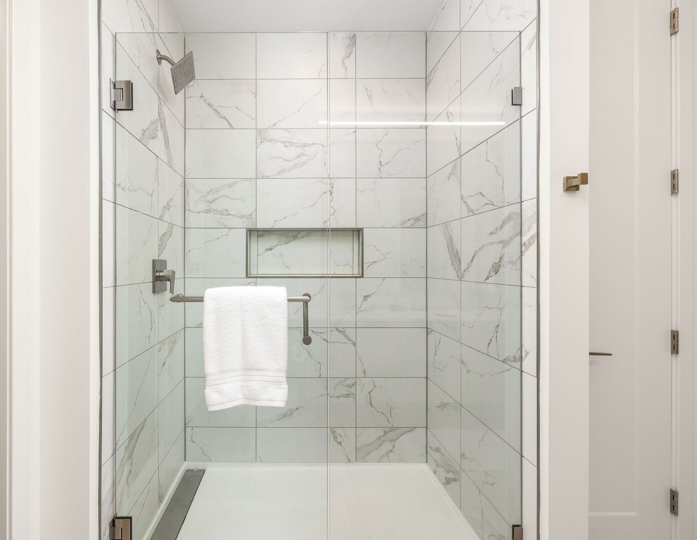 Spacious walk-in shower featuring Molton Brown amenities