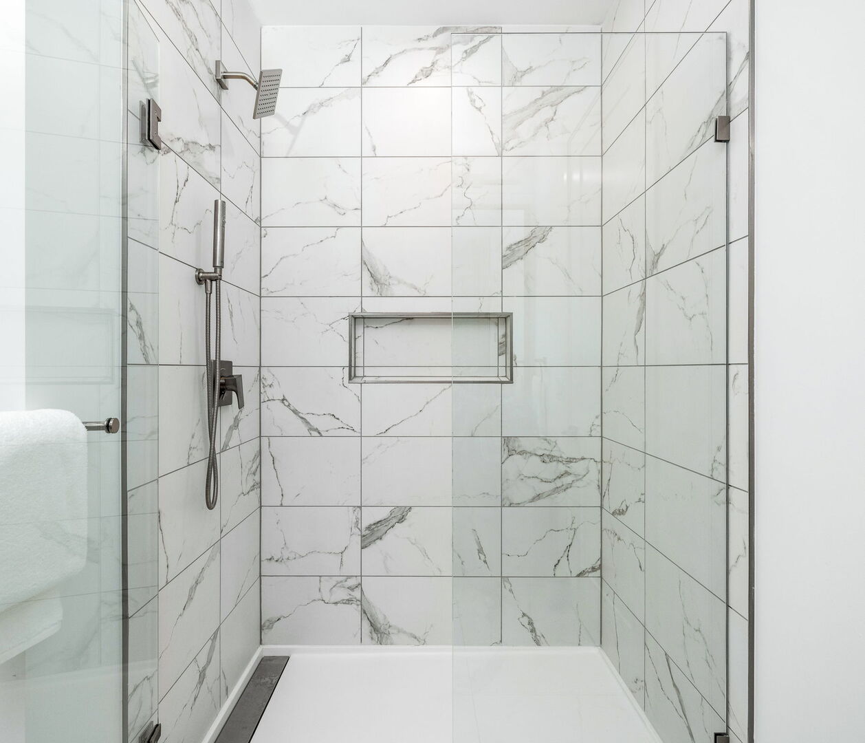 Spacious walk-in shower featuring Molton Brown amenities