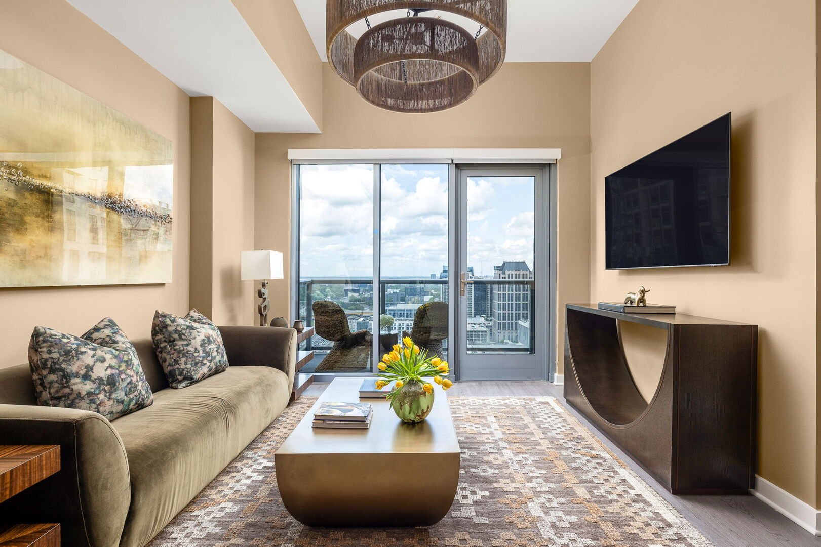 Living room featuring a 65 4K UHD TV