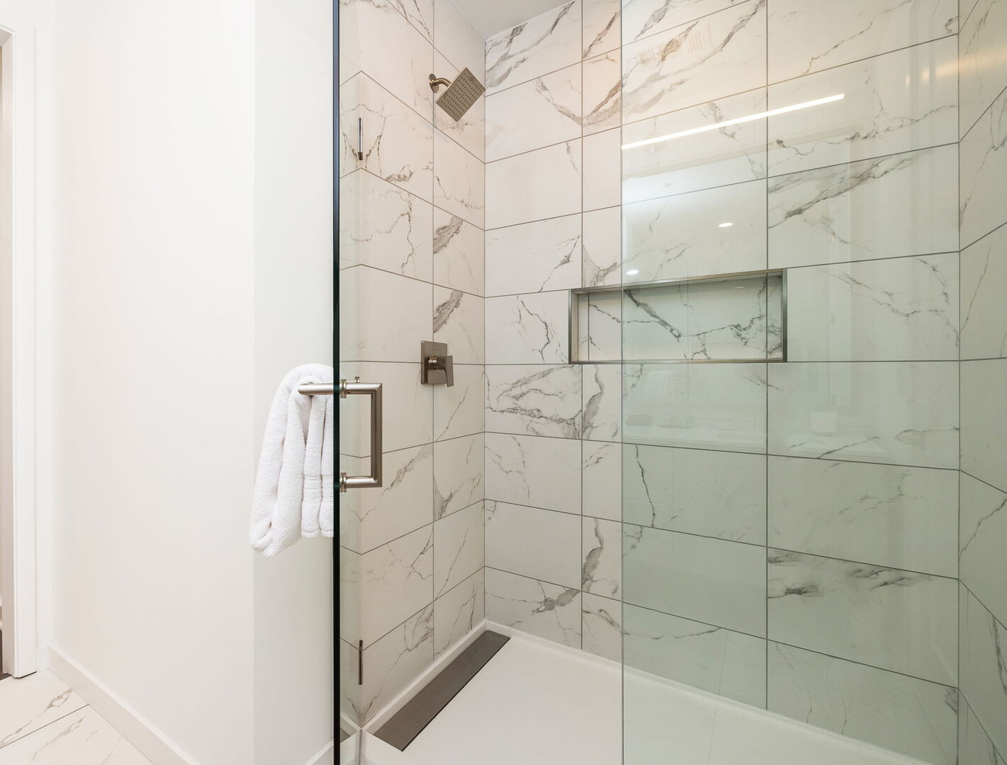 Spacious walk-in shower featuring Molton Brown amenities