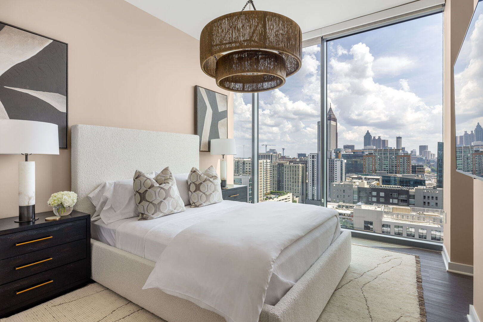 Secondary suite with a queen bed and a 55 4K UHD TV