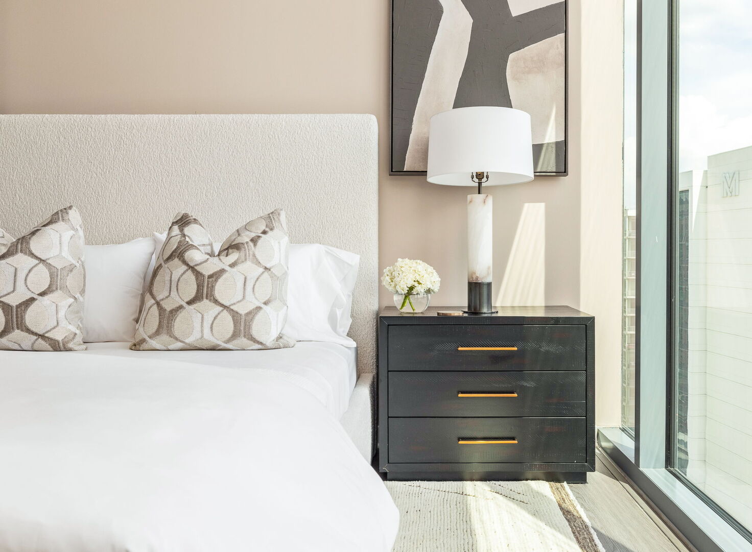 Secondary suite with a queen bed and a 55 4K UHD TV