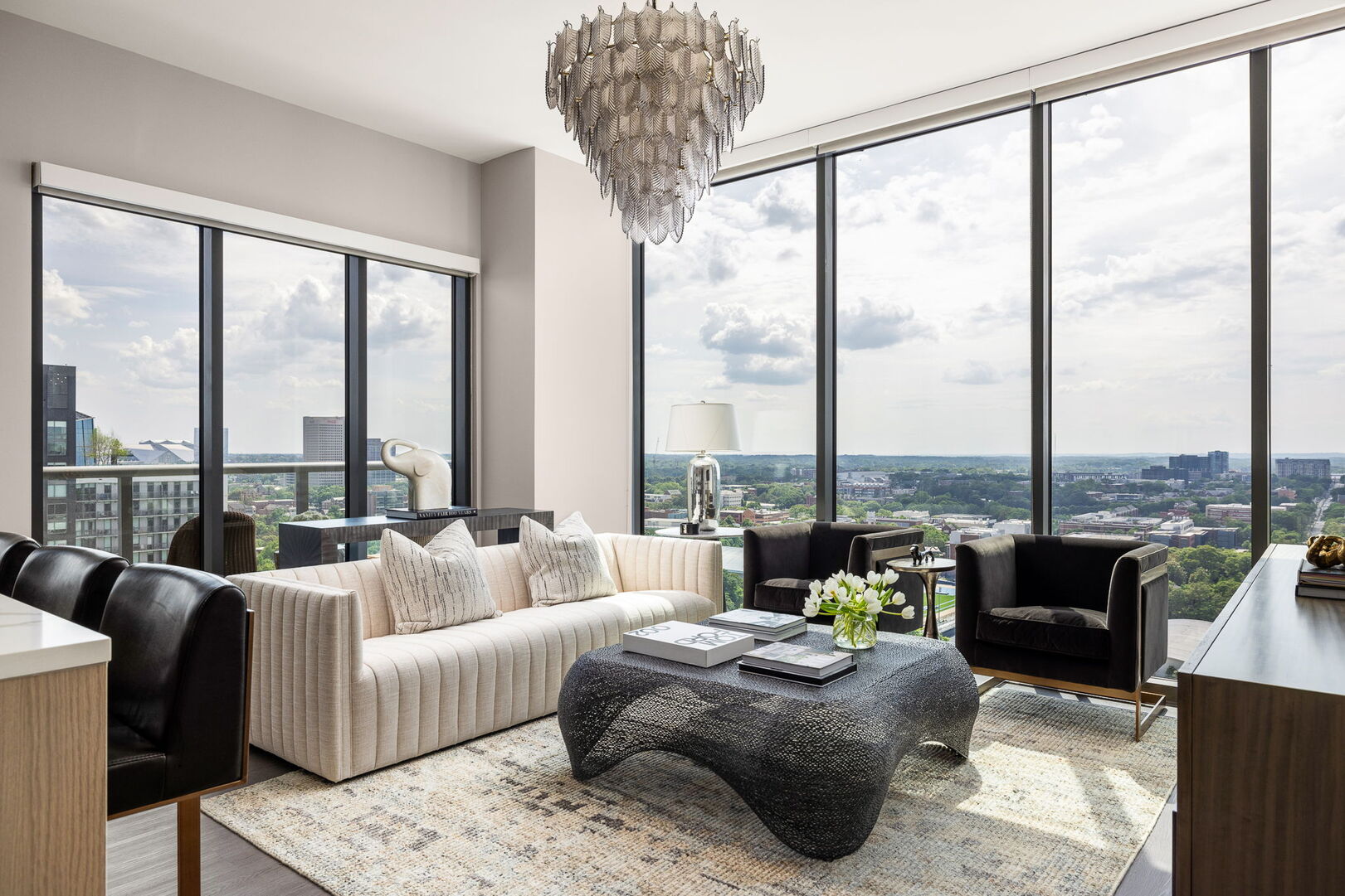 Living room featuring a 65 4K UHD TV