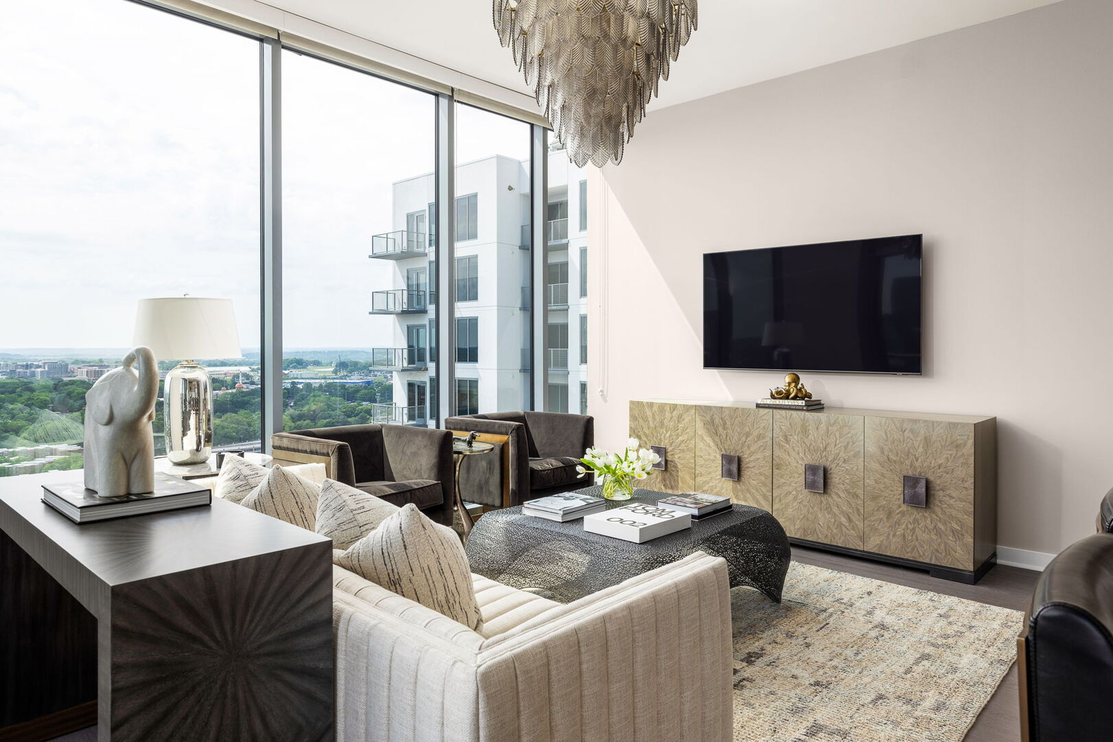 Living room featuring a 65 4K UHD TV