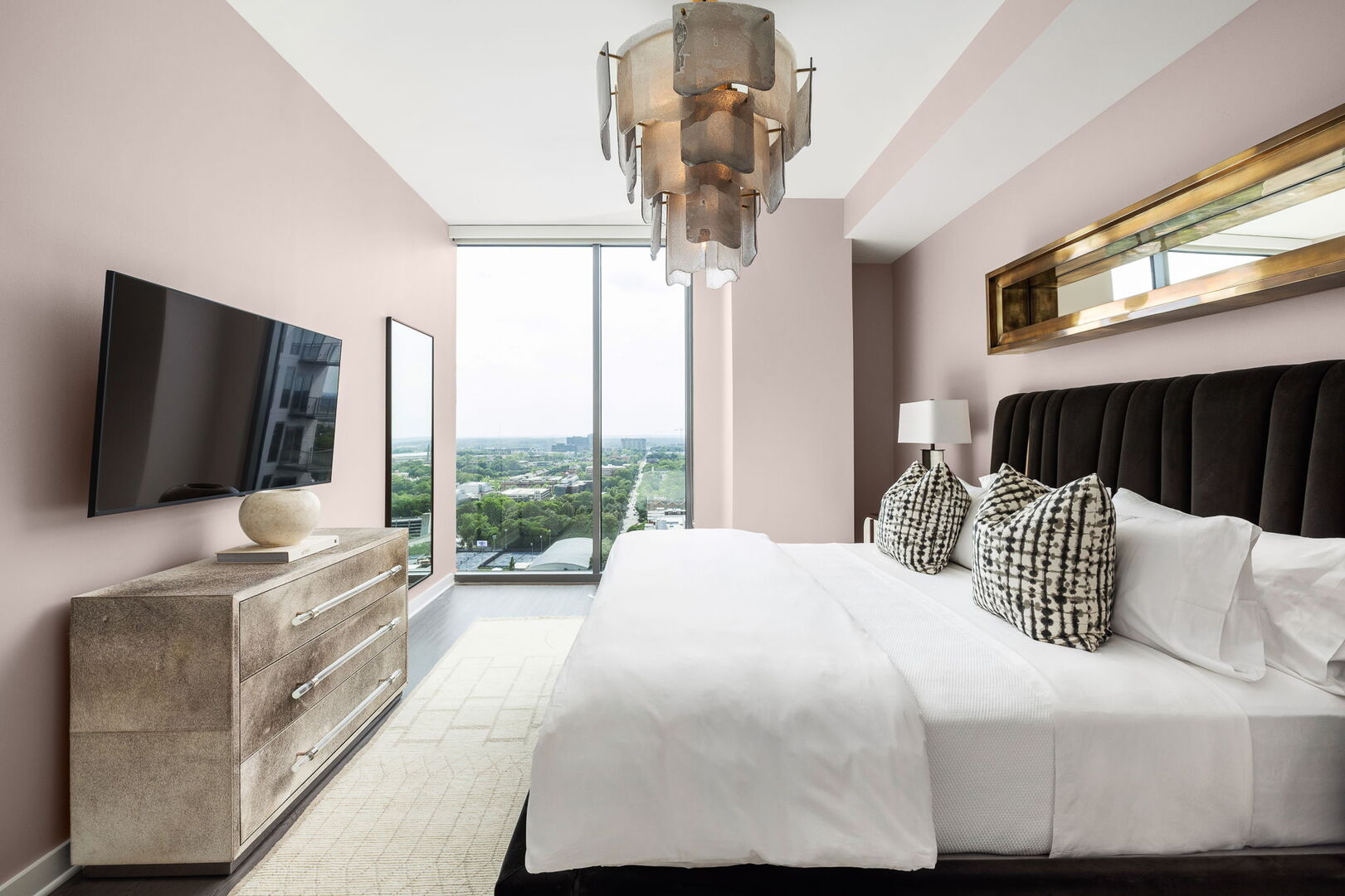 Primary suite with a king bed and a 55 4K UHD TV