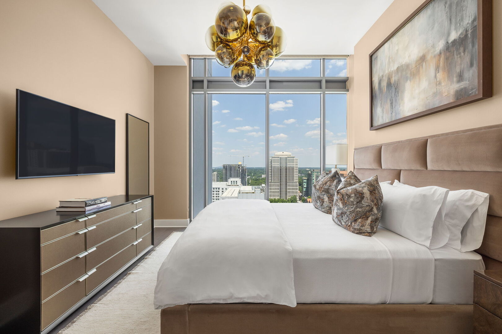 Primary suite with a king bed and a 55 4K UHD TV