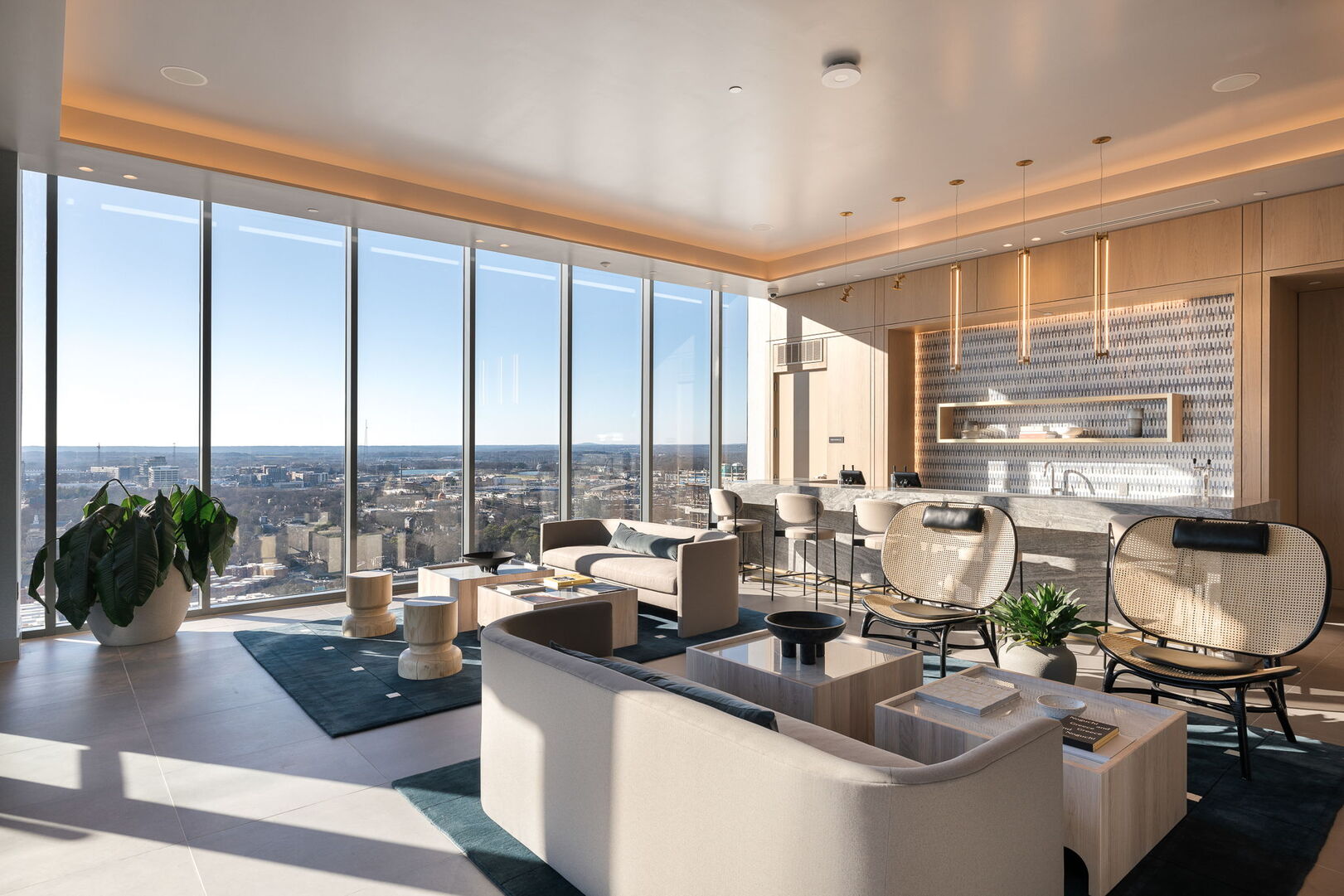 Sky deck lounge area with a bar and comfortable, lush seating