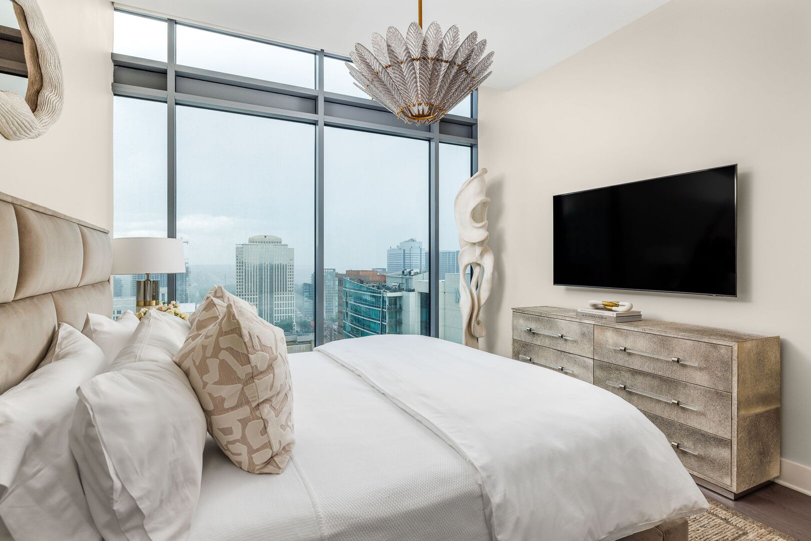 Secondary suite with a king bed and a 55 4K UHD TV