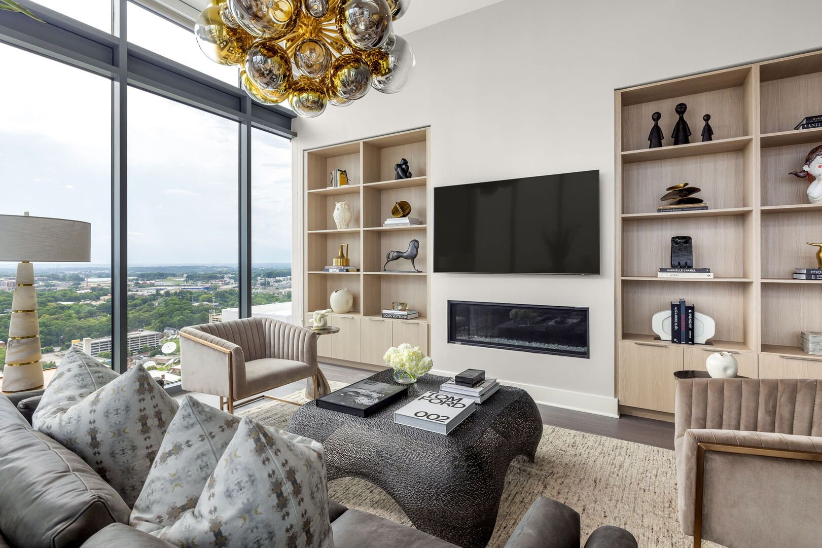 Living room featuring a 65 4K UHD TV