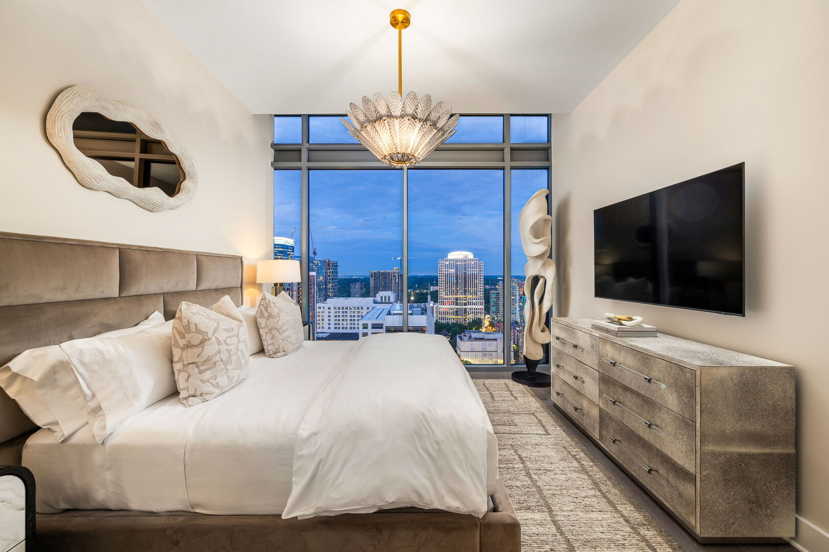 Secondary suite with a king bed and a 55 4K UHD TV