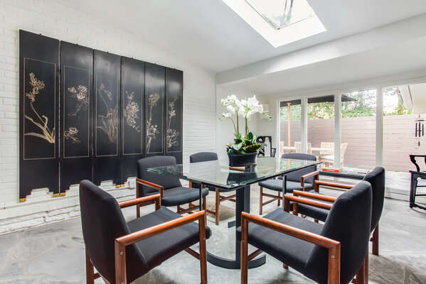 Dining Table, Chairs, and Sliding Doors to the Backyard.