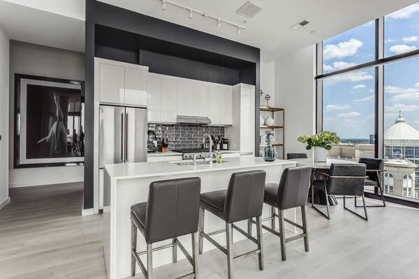 Kitchen Bar Includes Seating for Three.
