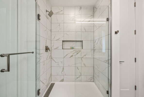Spacious walk-in shower featuring Molton Brown amenities