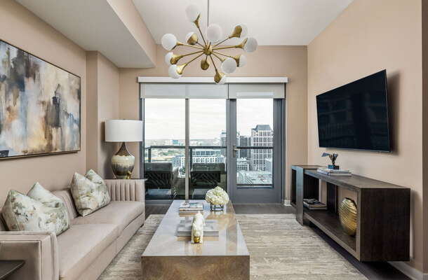 Living room featuring a 65 4K UHD TV