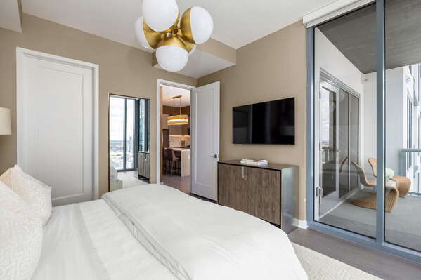 Primary suite with a king bed and a 55 4K UHD TV