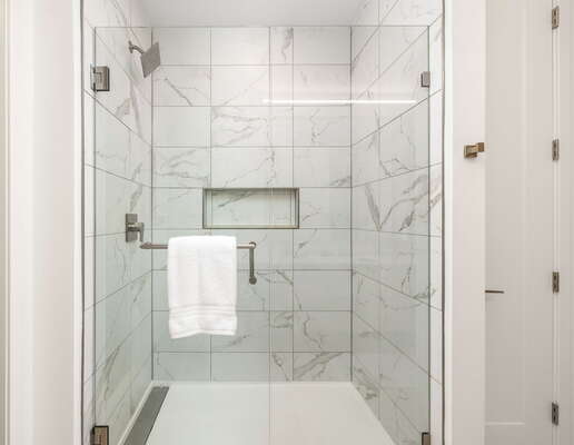 Spacious walk-in shower featuring Molton Brown amenities