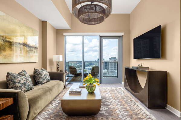 Living room featuring a 65 4K UHD TV