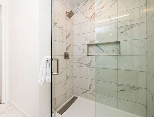 Spacious walk-in shower featuring Molton Brown amenities