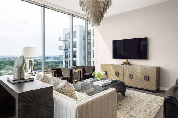 Living room featuring a 65 4K UHD TV