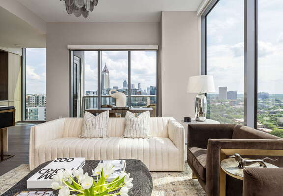 Living room featuring a 65 4K UHD TV