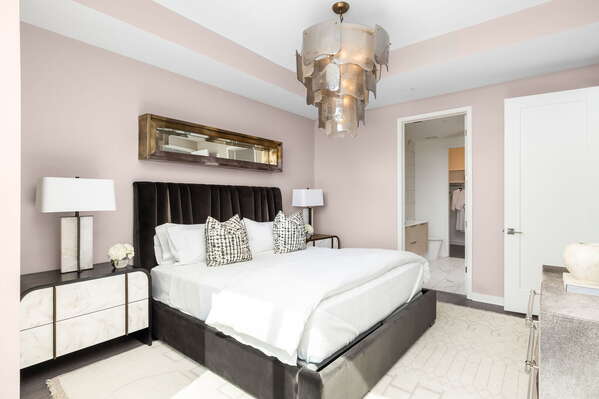 Primary suite with a king bed and a 55 4K UHD TV