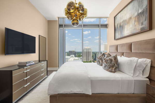 Primary suite with a king bed and a 55 4K UHD TV