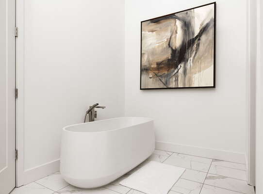 An en-suite bathroom featuring a double vanity and a spacious walk-in shower and a tub