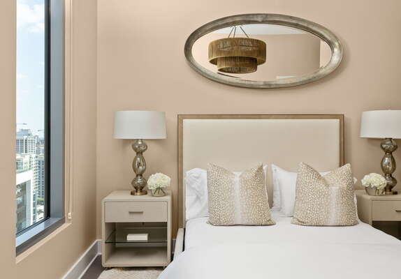 Guest suite with a queen bed and a 55 4K UHD TV