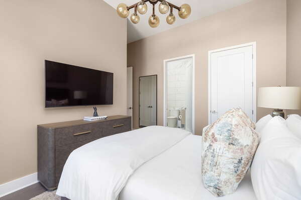 Guest suite with a queen bed and a 55 4K UHD TV