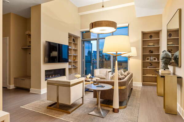 Living room featuring a 65 4K UHD TV