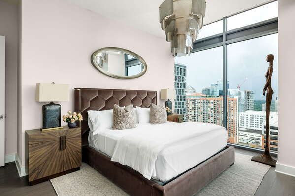 Primary suite with a king bed and a 55 4K UHD TV