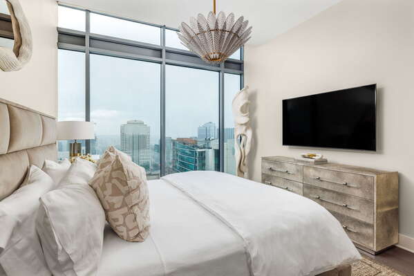 Secondary suite with a king bed and a 55 4K UHD TV