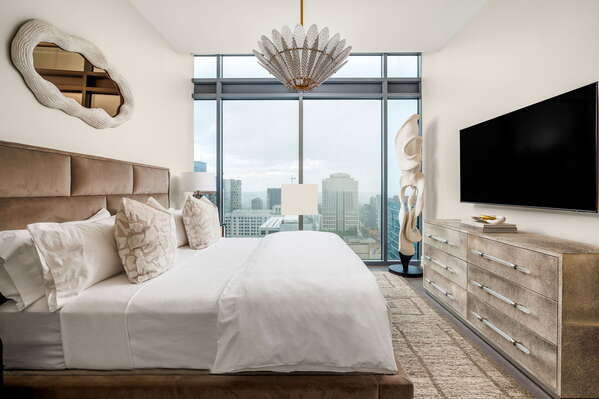 Secondary suite with a king bed and a 55 4K UHD TV