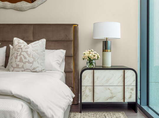 Secondary suite with a king bed and a 55 4K UHD TV