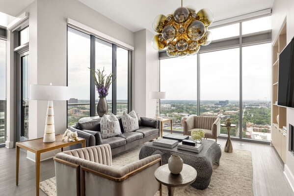 Living room featuring a 65 4K UHD TV