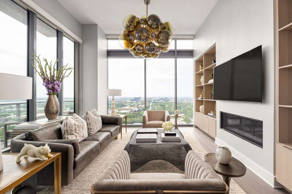 Living room featuring a 65 4K UHD TV